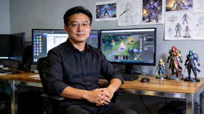 资深制作人陈昊照片，背景为PG电子游戏开发工作室环境